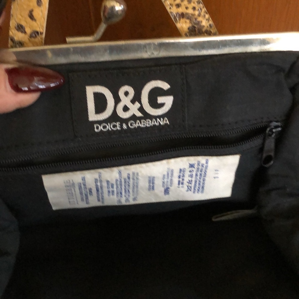 Genuine snakeskin Dolce & Gabbana purse lined with snap closure zipper pocket
